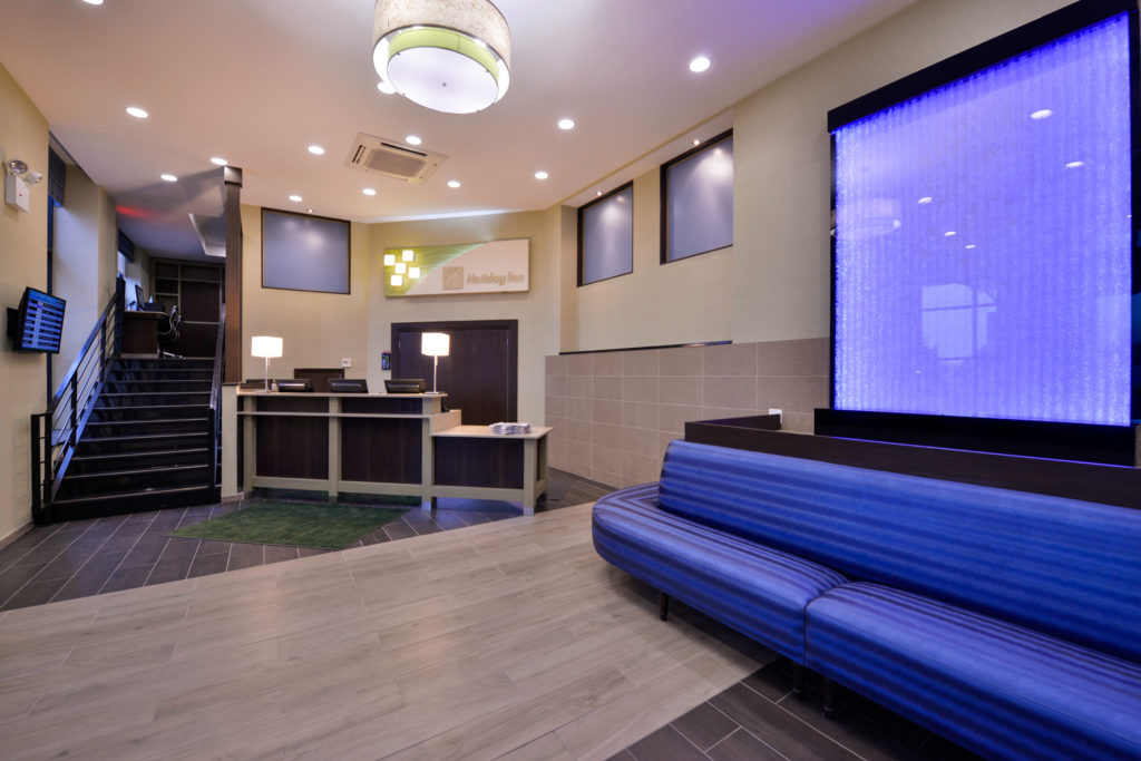 Holiday Inn New York JFK Airport Area front desk and lobby seating