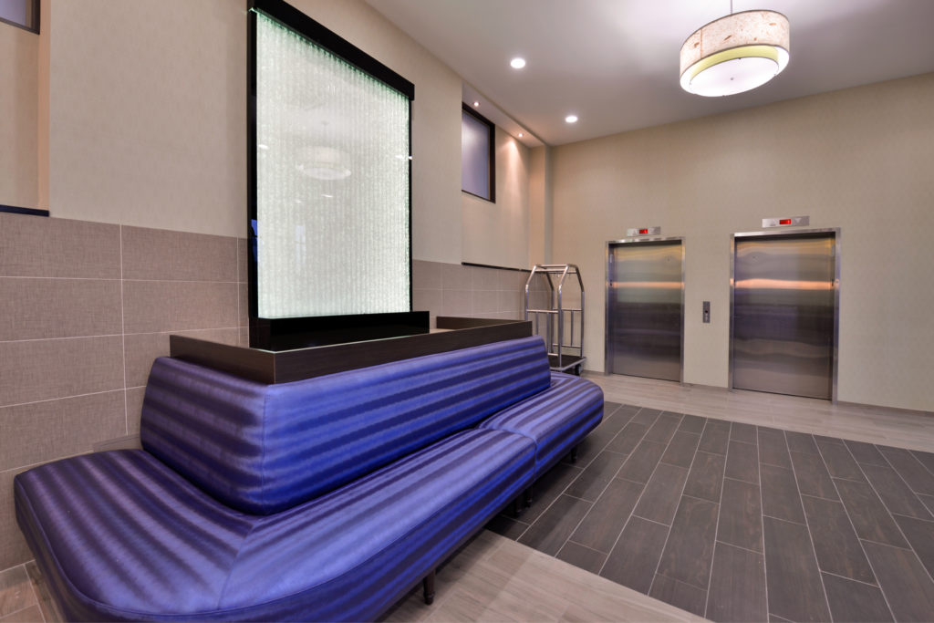 Holiday Inn New York JFK Airport Area lobby seating and elevators