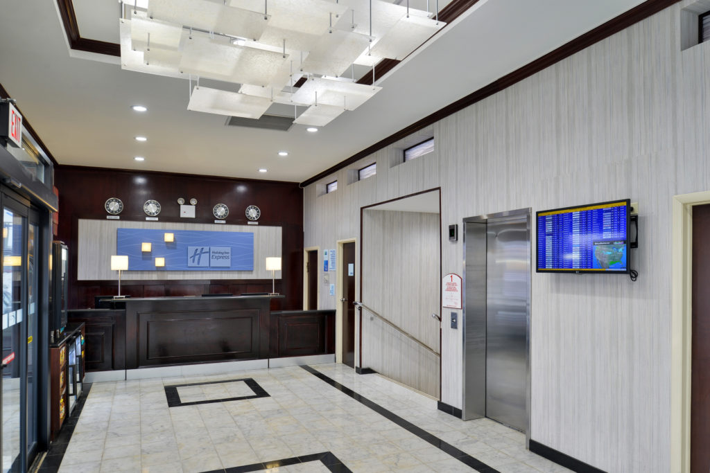 Holiday Inn Express New York JFK Airport Area front desk and elevator