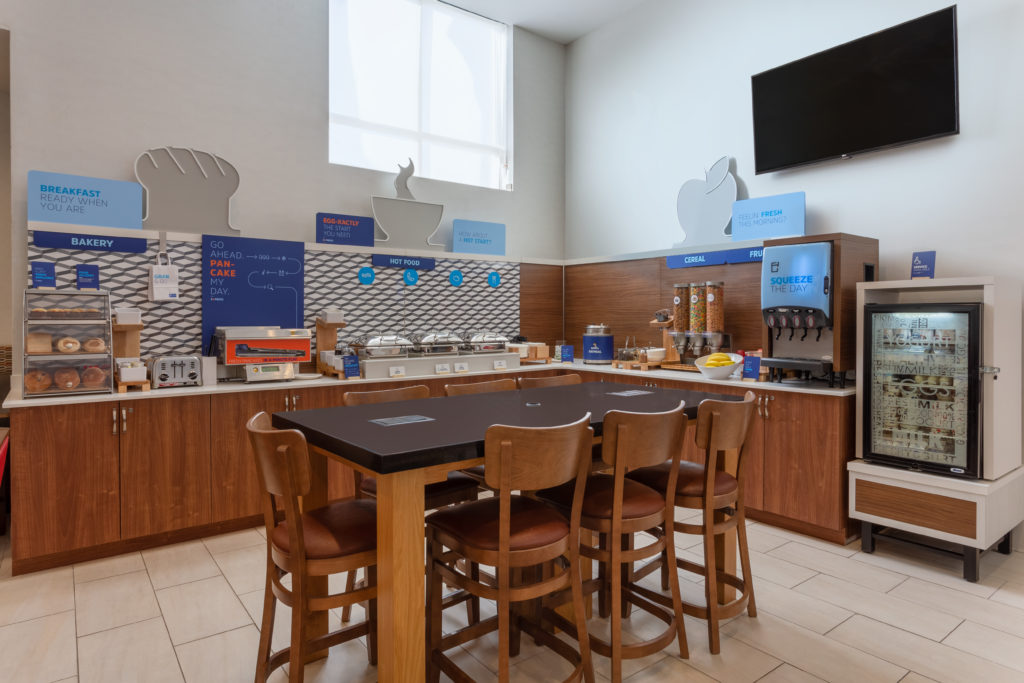 Holiday Inn Express LaGuardia Airport breakfast bar with seating