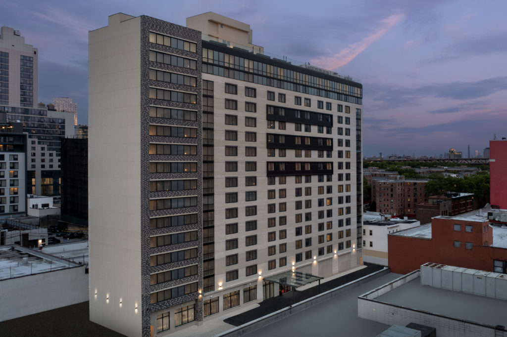 Residence Inn and SpringHill Suites Queens evening exterior
